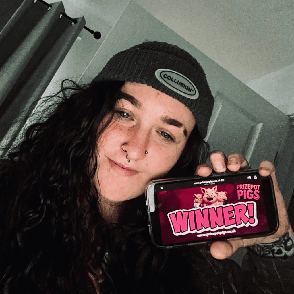 Woman holding phone with Prize Pot Pigs winner screen, celebrating success.